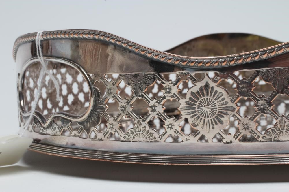 A LARGE PLATED ON COPPER OVAL TRAY with rosette and trellis pierced gallery Image