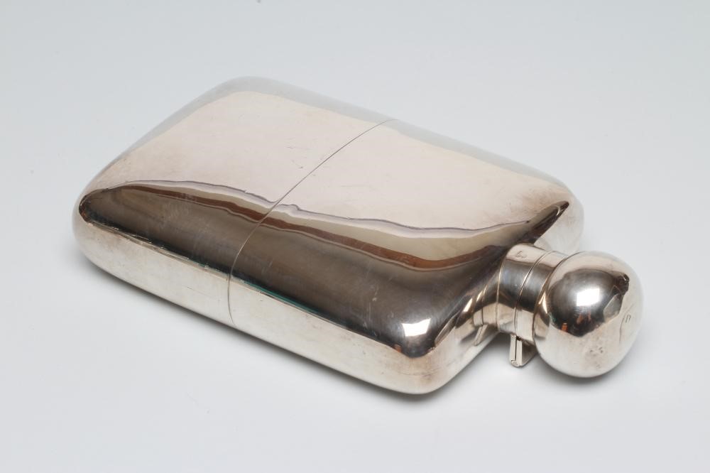 A LATE VICTORIAN SILVER HIP FLASK Image
