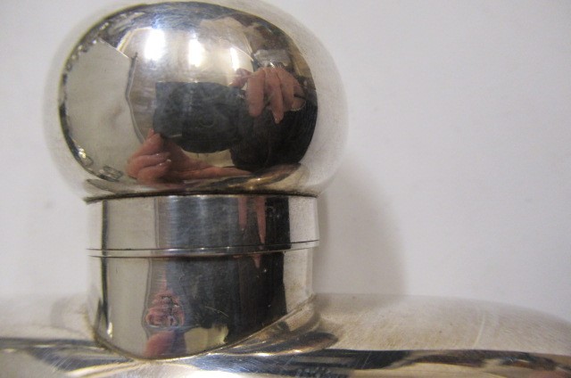 A LATE VICTORIAN SILVER HIP FLASK Image