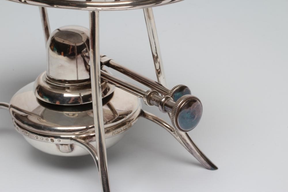 A SILVER TOAST-RACK ON STAND WITH BURNER Image