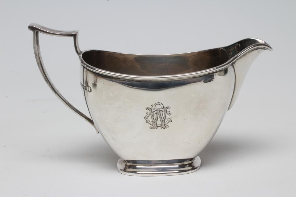 A SILVER THREE PIECE TEA SERVICE Image