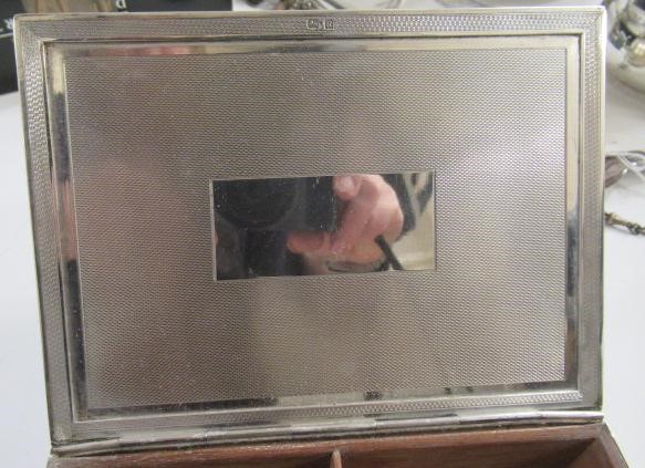 AN ART DECO SILVER CIGARETTE BOX Image