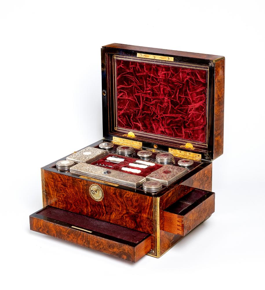 A MID VICTORIAN BURR WALNUT TRAVELLING DRESSING CASE WITH SILVER FITTINGS by Parkins & Gotto Image