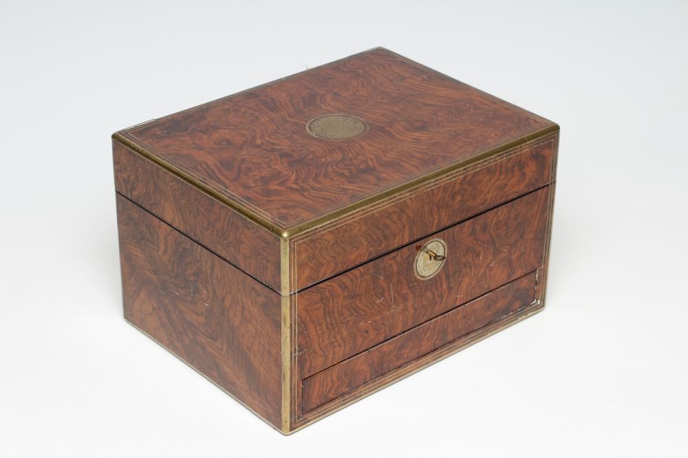 A MID VICTORIAN BURR WALNUT TRAVELLING DRESSING CASE WITH SILVER FITTINGS by Parkins & Gotto Image