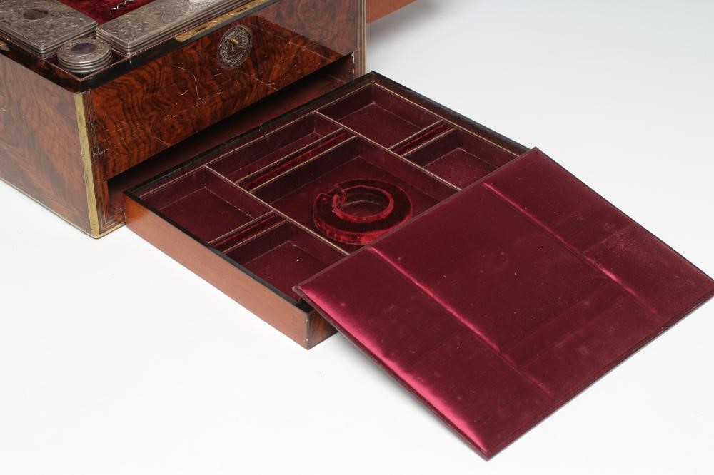 A MID VICTORIAN BURR WALNUT TRAVELLING DRESSING CASE WITH SILVER FITTINGS by Parkins & Gotto Image
