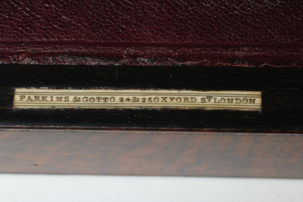 A MID VICTORIAN BURR WALNUT TRAVELLING DRESSING CASE WITH SILVER FITTINGS by Parkins & Gotto Image