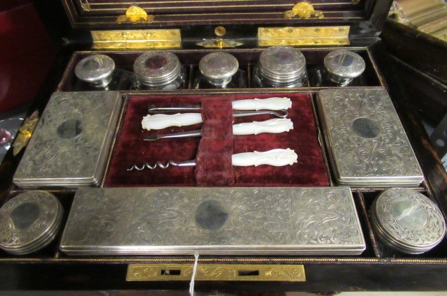 A MID VICTORIAN BURR WALNUT TRAVELLING DRESSING CASE WITH SILVER FITTINGS by Parkins & Gotto Image