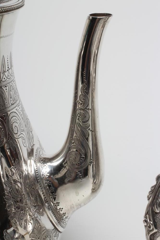 A VICTORIAN SILVER FOUR PIECE TEA AND COFFEE SERVICE Image