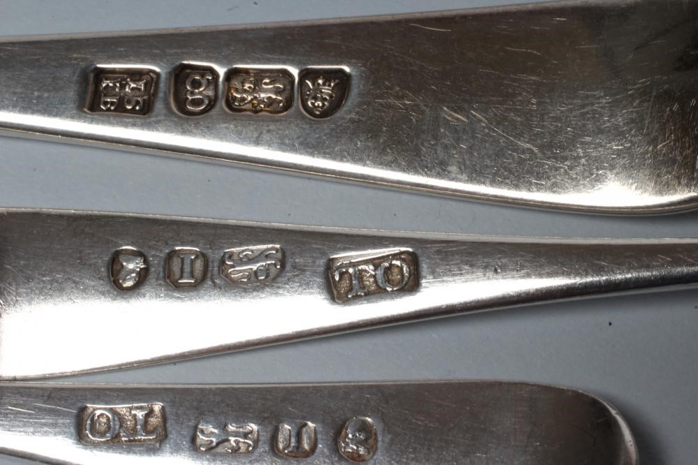 A SET OF FOUR GEORGE III SILVER DESSERT SPOONS Image