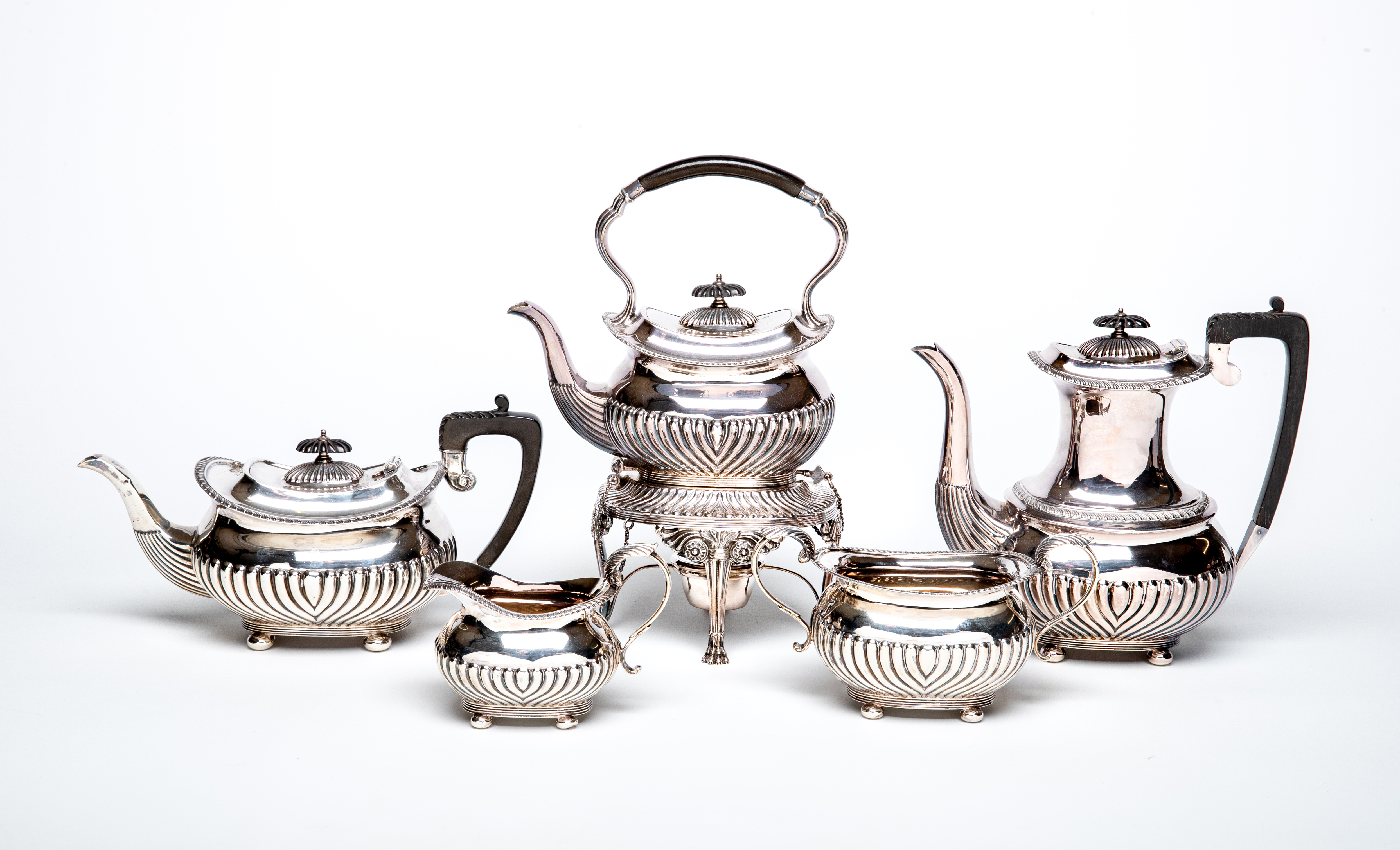 AN EDWARDIAN SILVER FIVE PIECE TEA AND COFFEE SERVICE Image