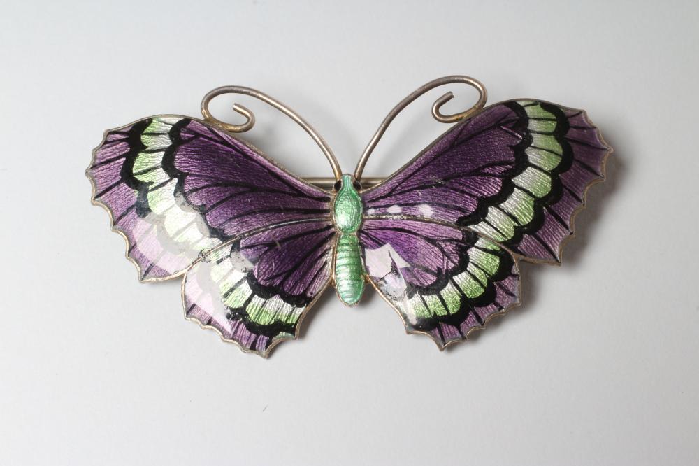 A STERLING SILVER AND ENAMEL BUTTERFLY BROOCH with green and black markings to dark lilac wings and Image