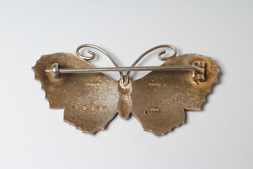 A STERLING SILVER AND ENAMEL BUTTERFLY BROOCH with green and black markings to dark lilac wings and Image