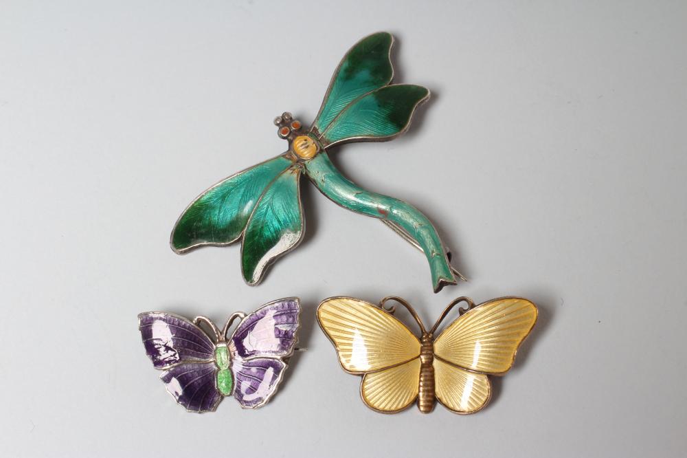 A STERLING SILVER AND ENAMEL DRAGONFLY BROOCH with green wings and tail and yellow thorax Image