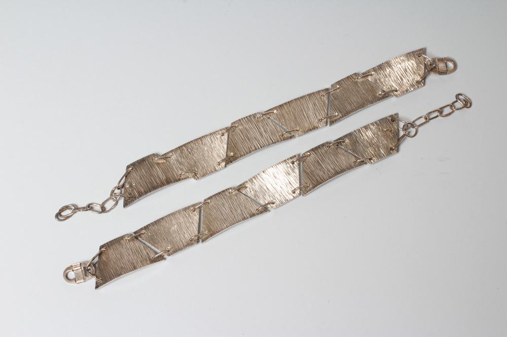 A PAIR OF SILVER BRACELETS Image