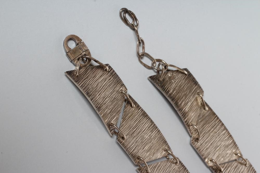 A PAIR OF SILVER BRACELETS Image