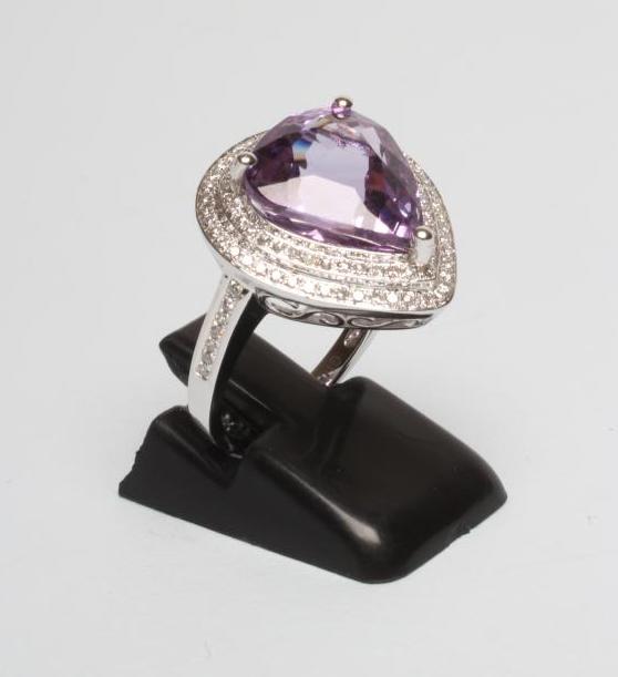 AN AMETHYST AND DIAMOND DRESS RING Image