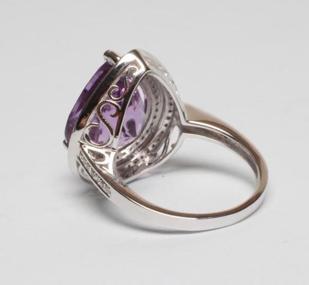 AN AMETHYST AND DIAMOND DRESS RING Image