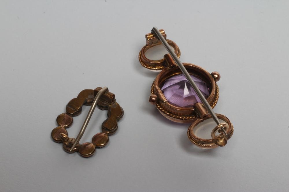 A VICTORIAN AMETHYST AND MOONSTONE BROOCH Image