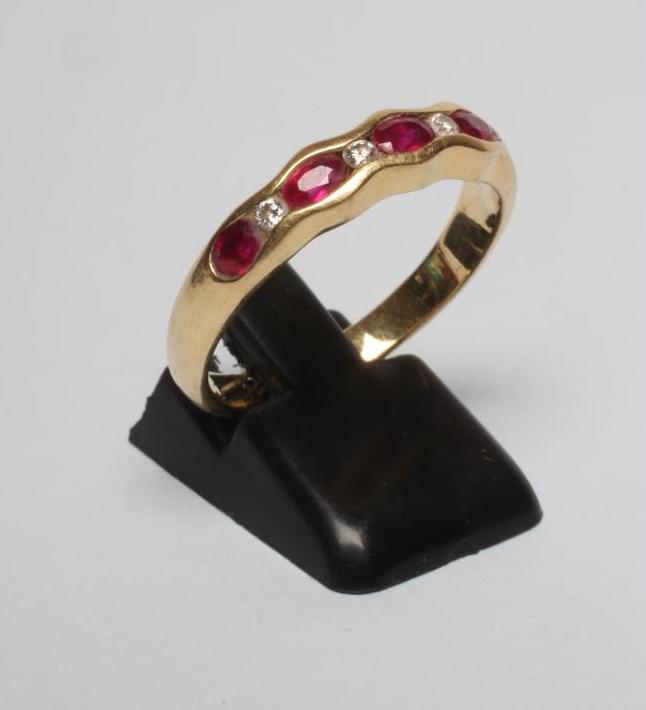 A RUBY HALF HOOP RING Image