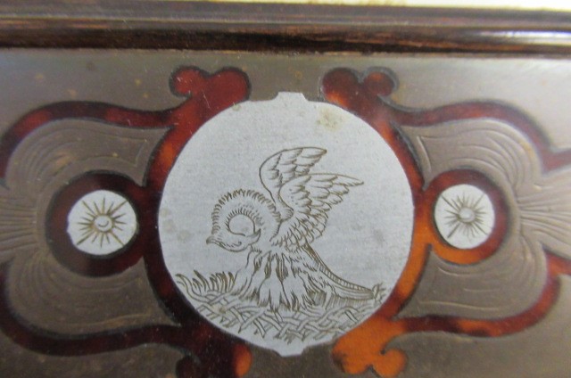 A PAIR OF ENGLISH EDWARDIAN CONTRA-PARTIE BOULLE PHOTOGRAPH FRAMES of plain strut back oblong form Image