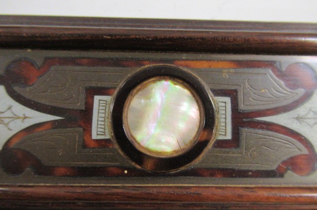 A PAIR OF ENGLISH EDWARDIAN CONTRA-PARTIE BOULLE PHOTOGRAPH FRAMES of plain strut back oblong form Image