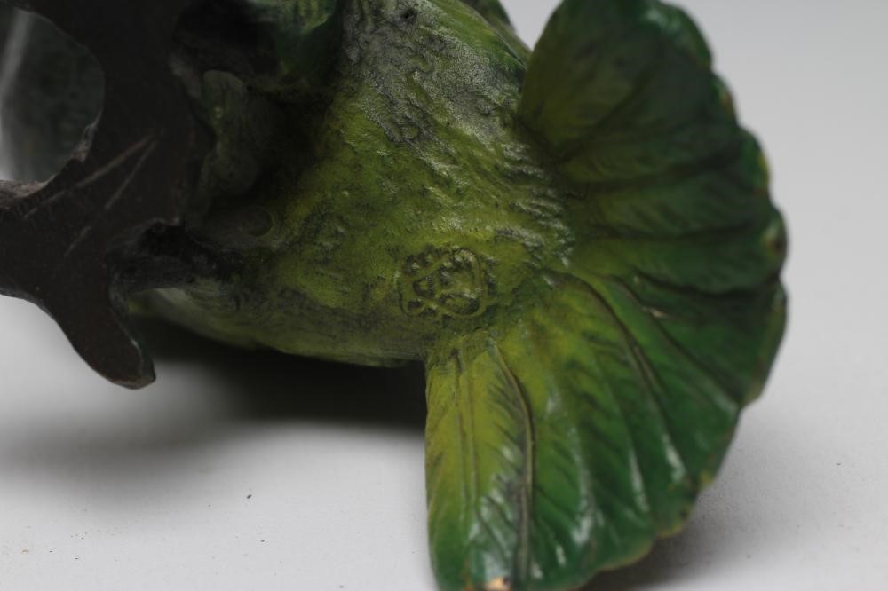 A BERGMANN STYLE BRONZE PARROT with red crest and green feathers Image