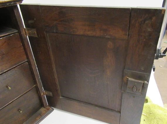 AN OAK SPICE CUPBOARD Image