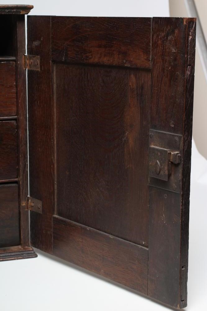 AN OAK SPICE CUPBOARD Image