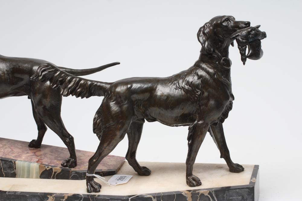 AN ART DECO BRONZED METAL GROUP of a retriever and a setter Image