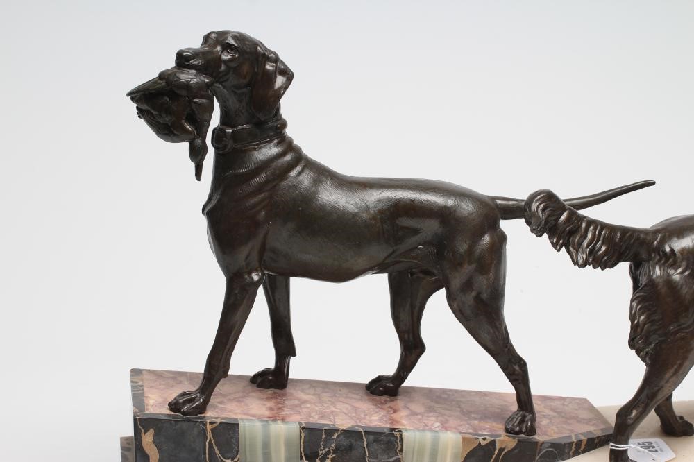 AN ART DECO BRONZED METAL GROUP of a retriever and a setter Image