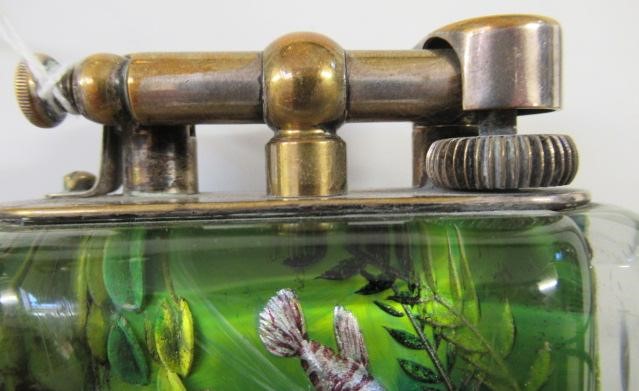 A DUNHILL LUCITE AQUARIUM TABLE LIGHTER by Margaret Bennett Image