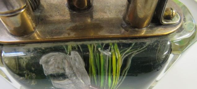 A DUNHILL LUCITE AQUARIUM TABLE LIGHTER by Margaret Bennett Image