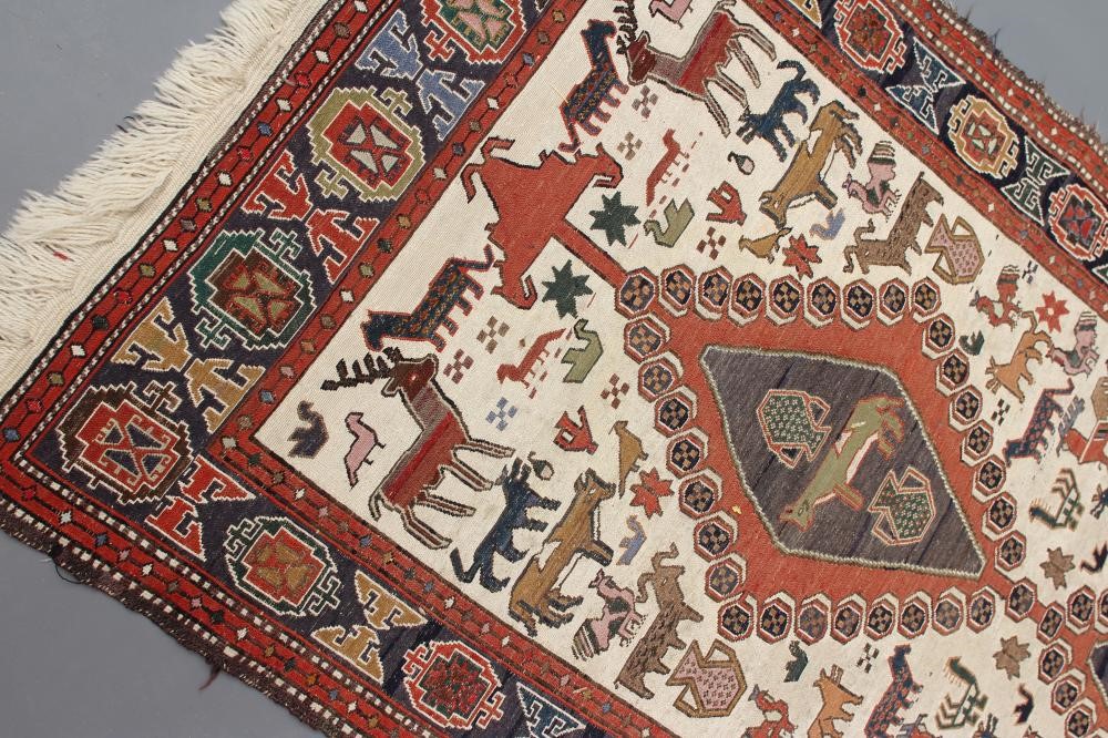 A PERSIAN TRIBAL RUG Image