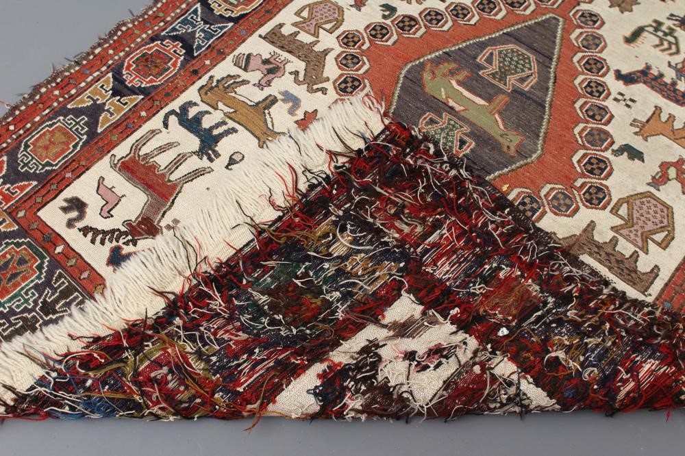 A PERSIAN TRIBAL RUG Image