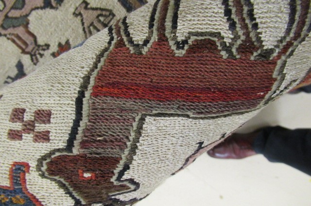 A PERSIAN TRIBAL RUG Image