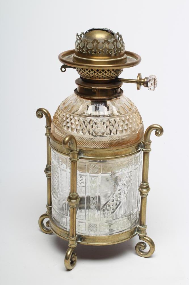 A VICTORIAN BRASS AND GLASS PATENT OIL LAMP of cylindrical form Image