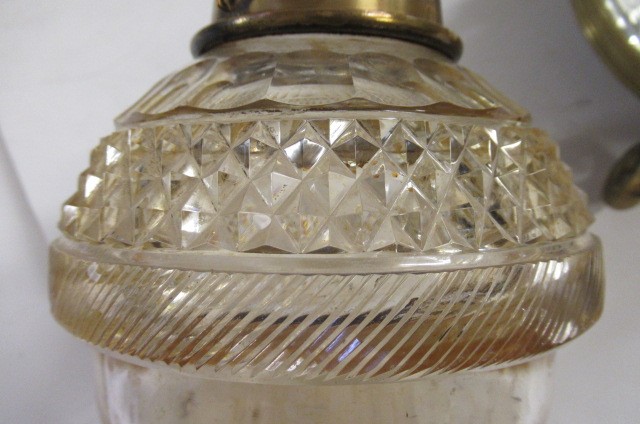 A VICTORIAN BRASS AND GLASS PATENT OIL LAMP of cylindrical form Image