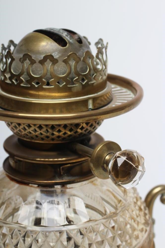 A VICTORIAN BRASS AND GLASS PATENT OIL LAMP of cylindrical form Image