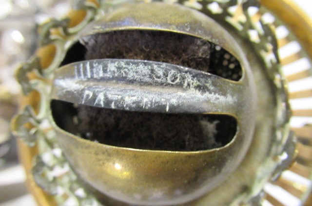 A VICTORIAN BRASS AND GLASS PATENT OIL LAMP of cylindrical form Image