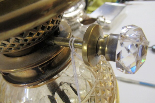 A VICTORIAN BRASS AND GLASS PATENT OIL LAMP of cylindrical form Image