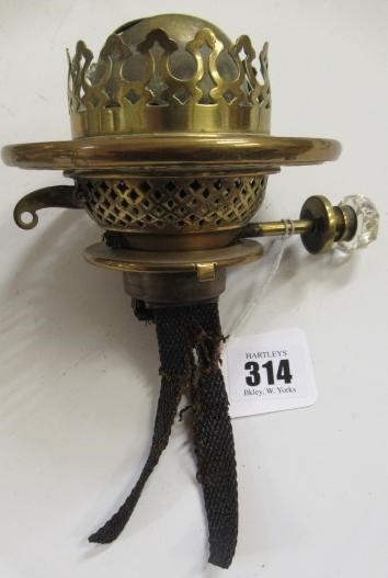 A VICTORIAN BRASS AND GLASS PATENT OIL LAMP of cylindrical form Image
