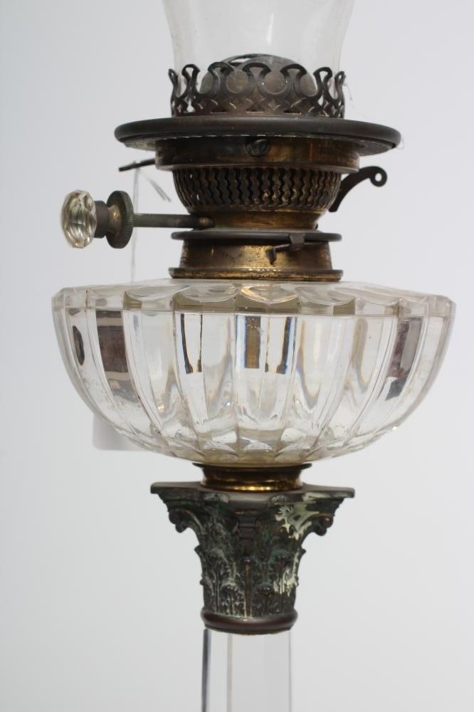 AN EARLY VICTORIAN GLASS OIL LAMP Image