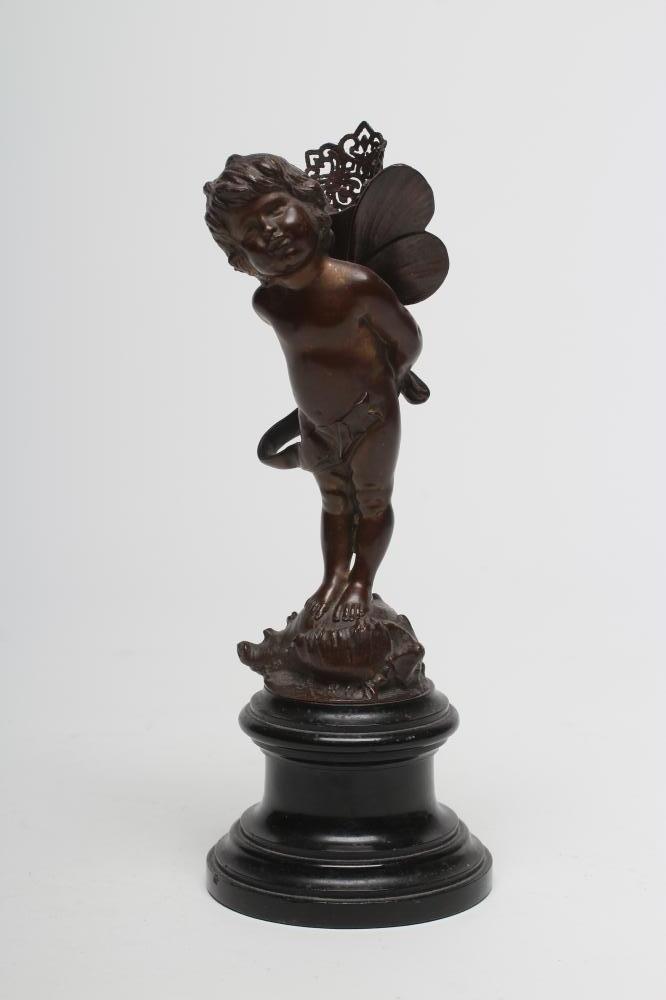 A BRONZE FIGURE OF CUPID Image