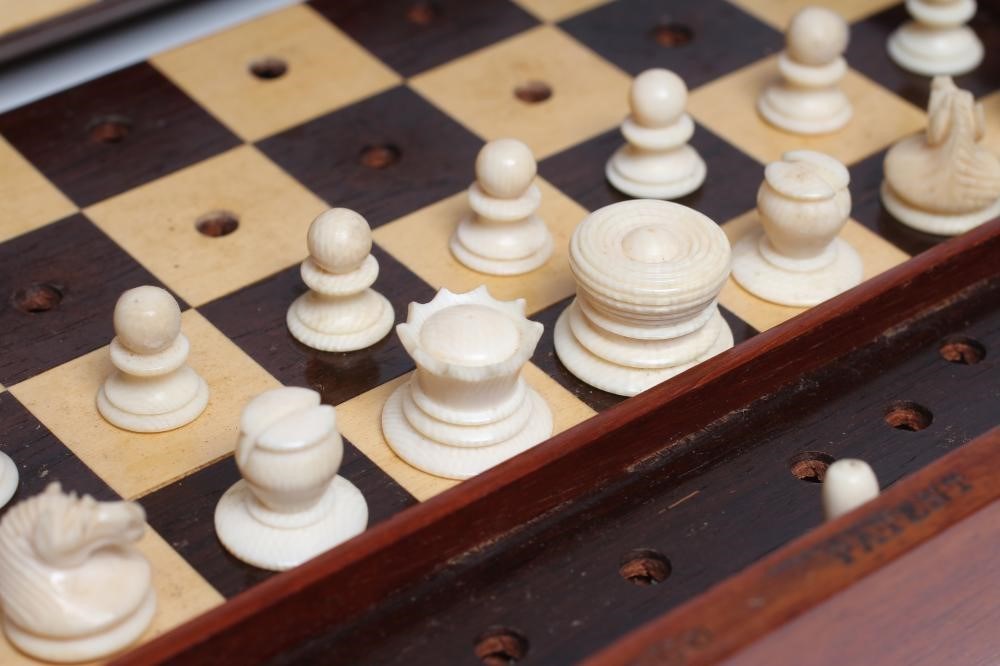 A JAQUES "IN STATU QUO" PATENT IVORY CHESS SET similar to the previous lot in ivory  (Est. plus 21% Image