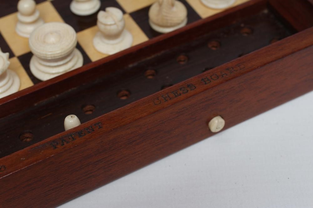 A JAQUES "IN STATU QUO" PATENT IVORY CHESS SET similar to the previous lot in ivory  (Est. plus 21% Image