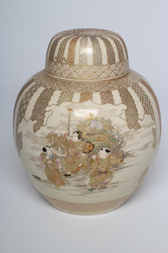 A SATSUMA EARTHENWARE JAR AND COVERS painted in pale palette with two vignettes of three children Image