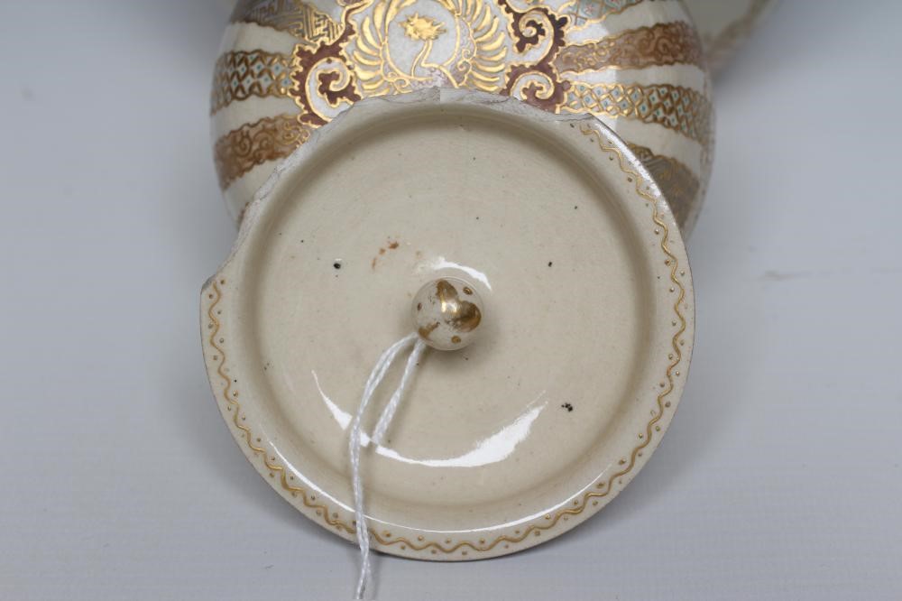 A SATSUMA EARTHENWARE JAR AND COVERS painted in pale palette with two vignettes of three children Image