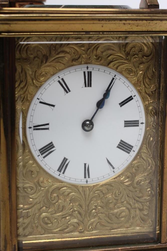 A BRASS CASED CARRIAGE CLOCK Image