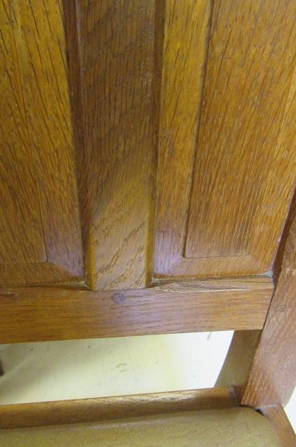 A COLIN ALMACK ADZED OAK DINING SUITE comprising multi panelled sideboard Image