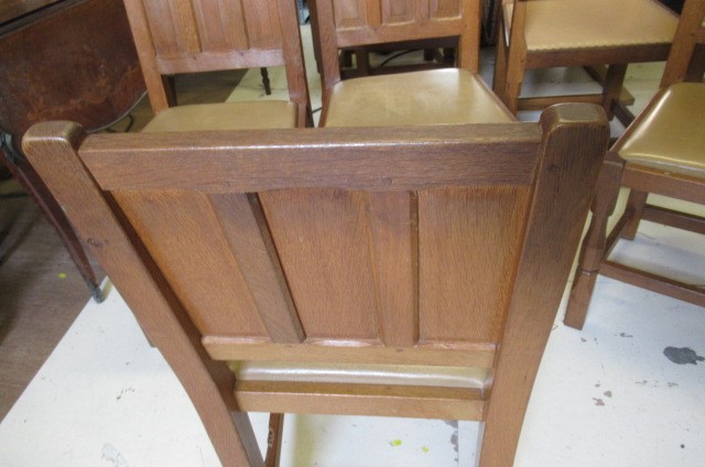 A COLIN ALMACK ADZED OAK DINING SUITE comprising multi panelled sideboard Image